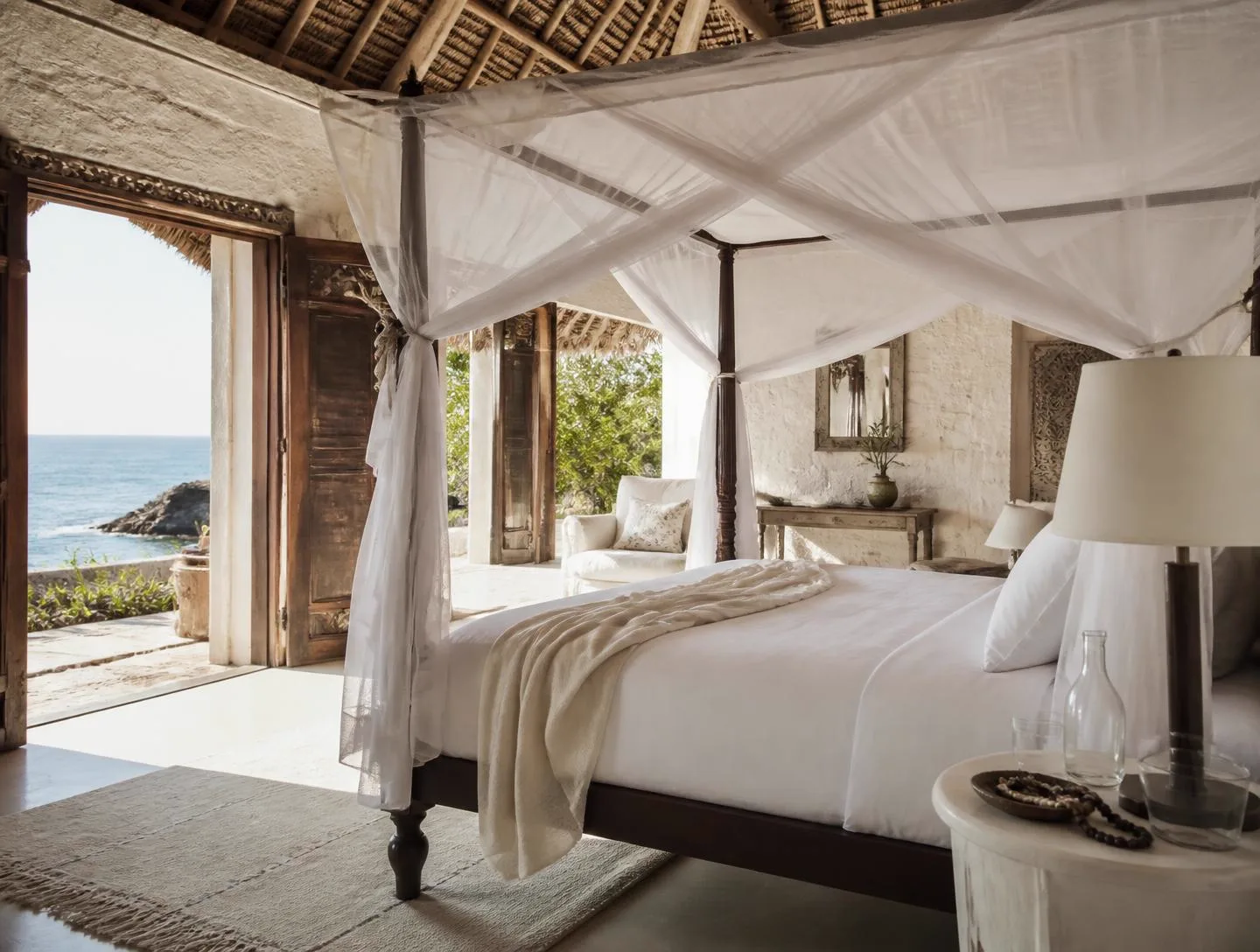 Bedroom one at Coral Retreat with a king bed and garden doors, ocean-view villa on Vipingo Ridge, Kenya